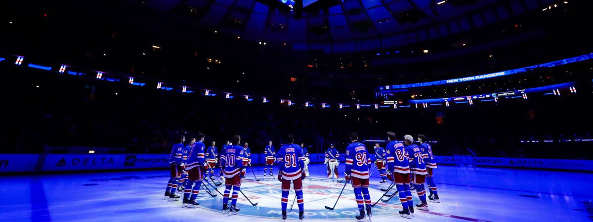 New York Rangers hockey players standing at center ice